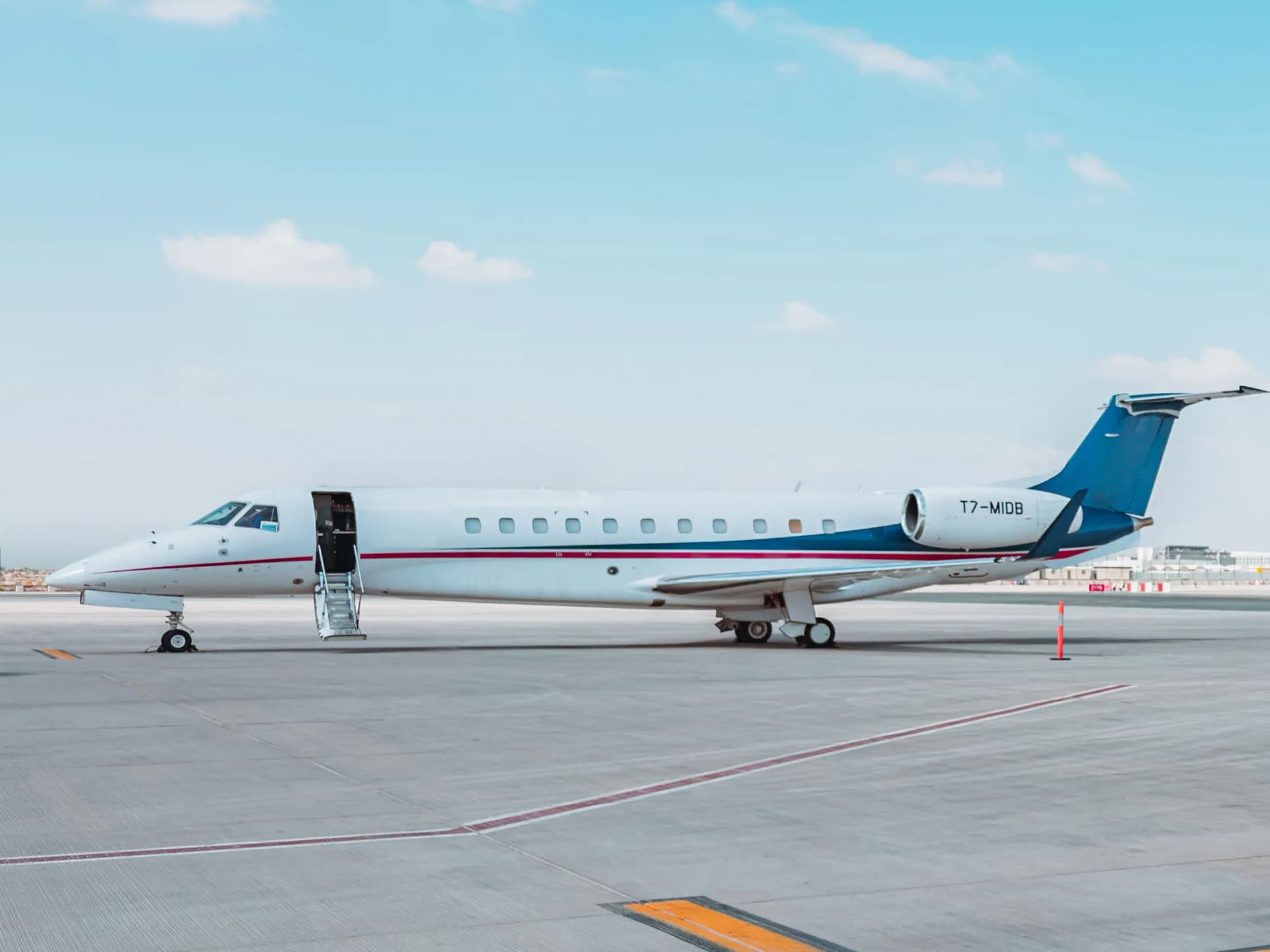 Embraer Legacy 650 T7-MIDB in side profile on the Dubai ramp